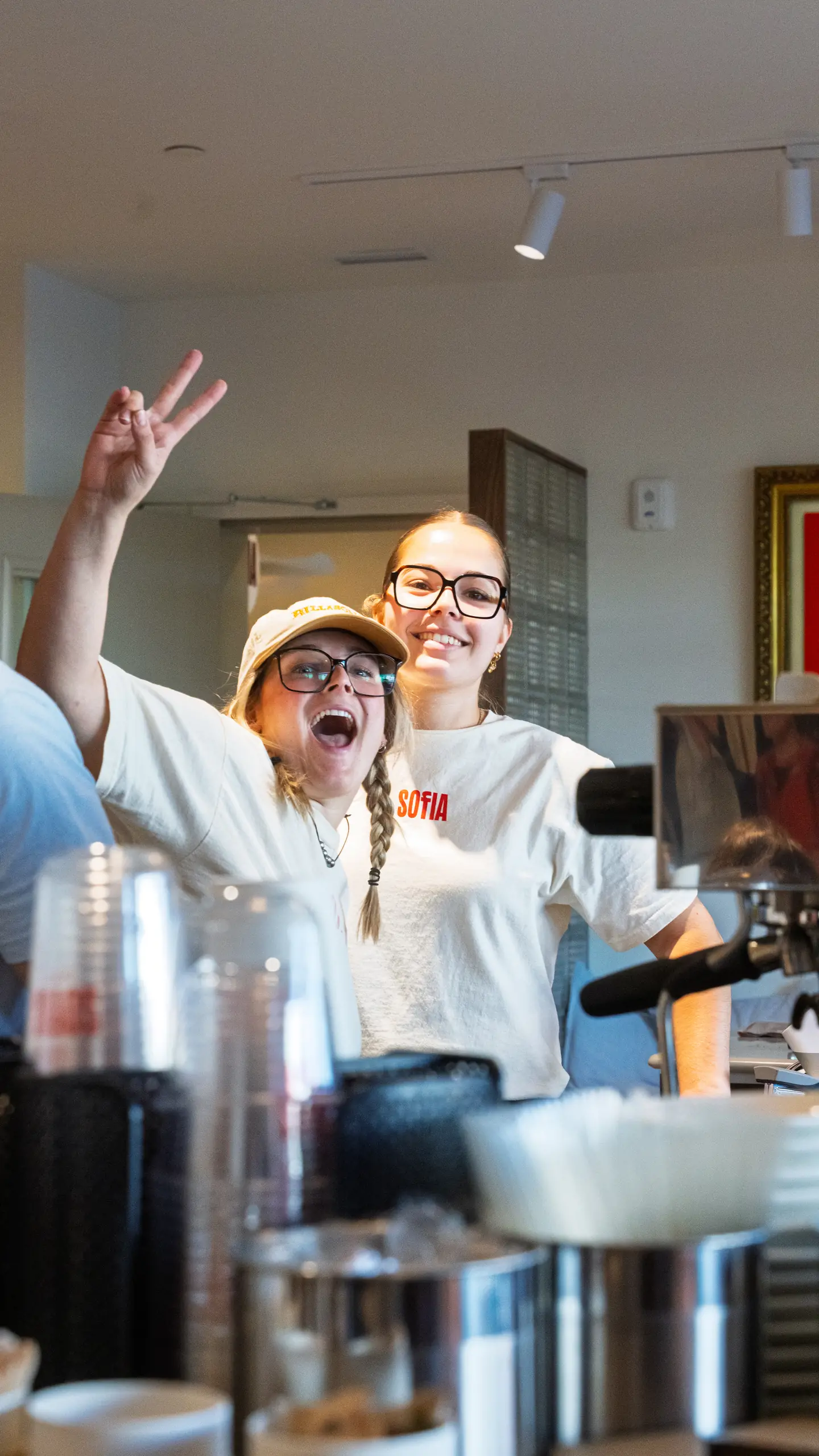 The team celebrating the opening behind the counter
