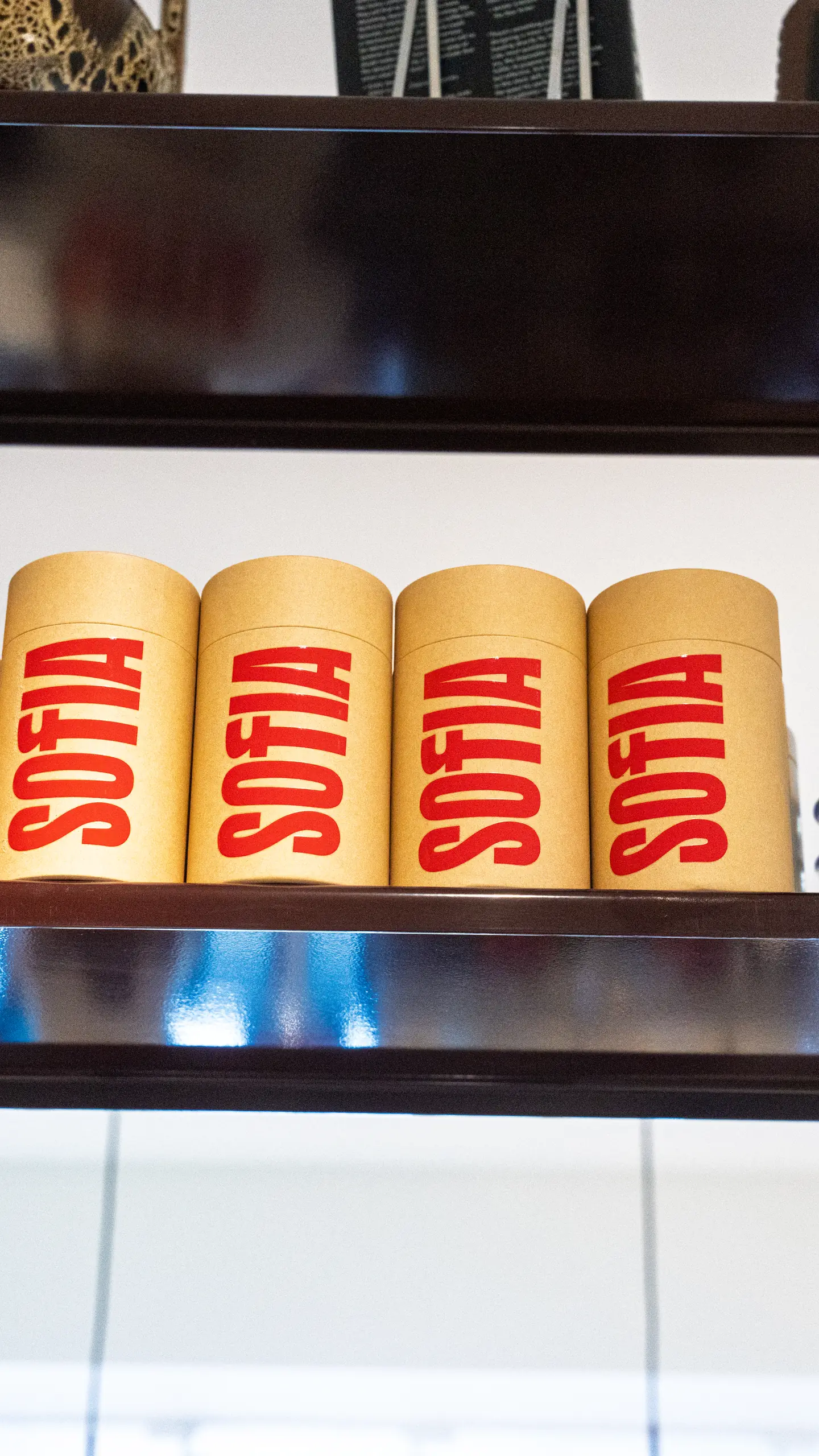 Sofia coffee tins lined up on a shelf